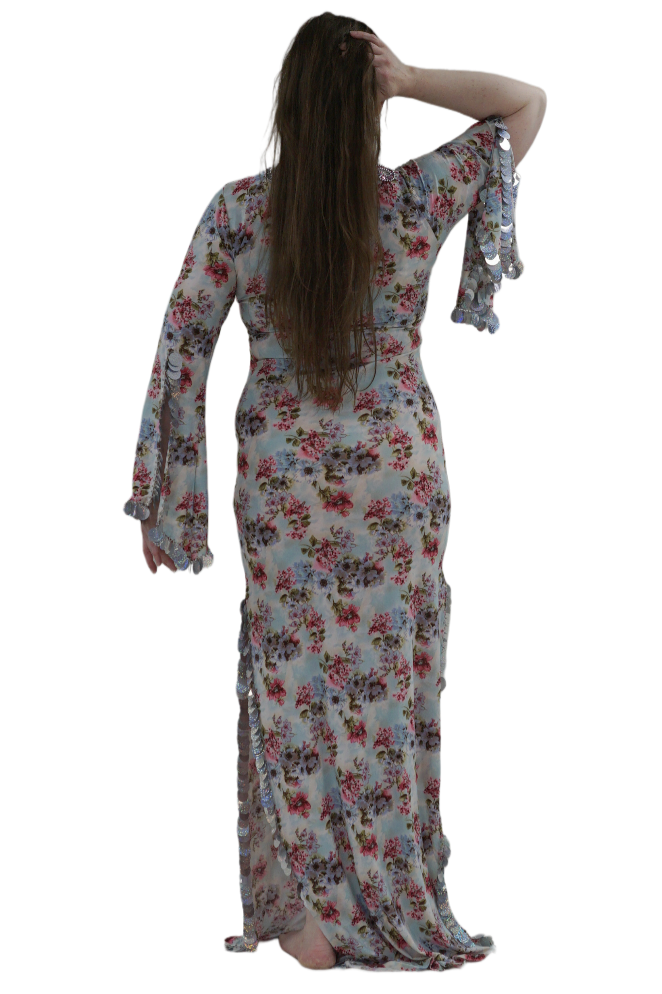 Woman wearing a floral dress with long sleeves on a white background