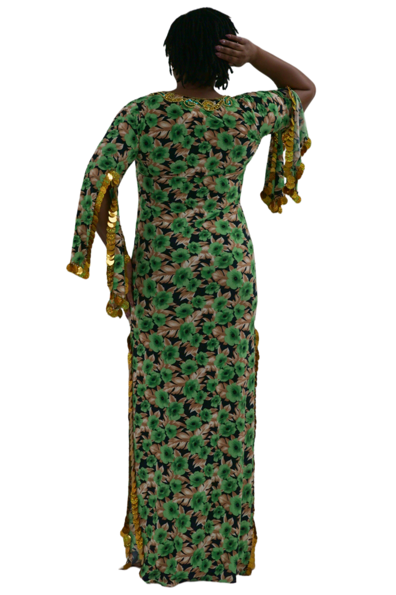 Woman wearing a green floral balady dress with gold accents on a white background