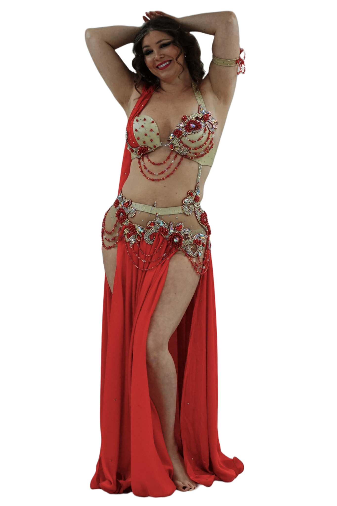 Woman in a rose and gold belly dance costume on a white background