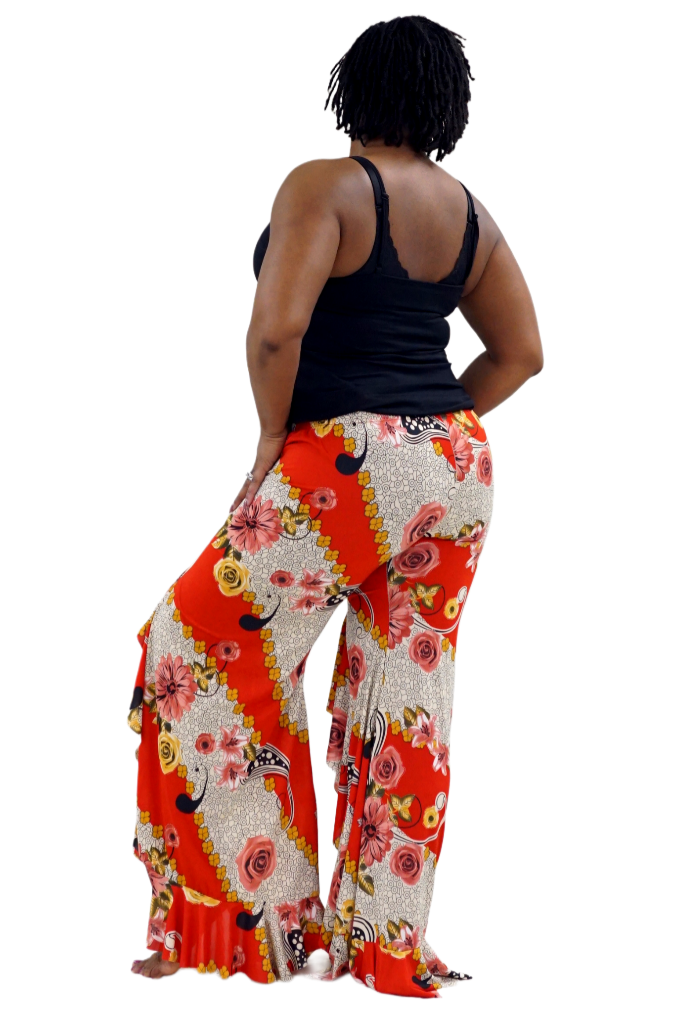 Woman wearing colorful floral pants with ruffles
