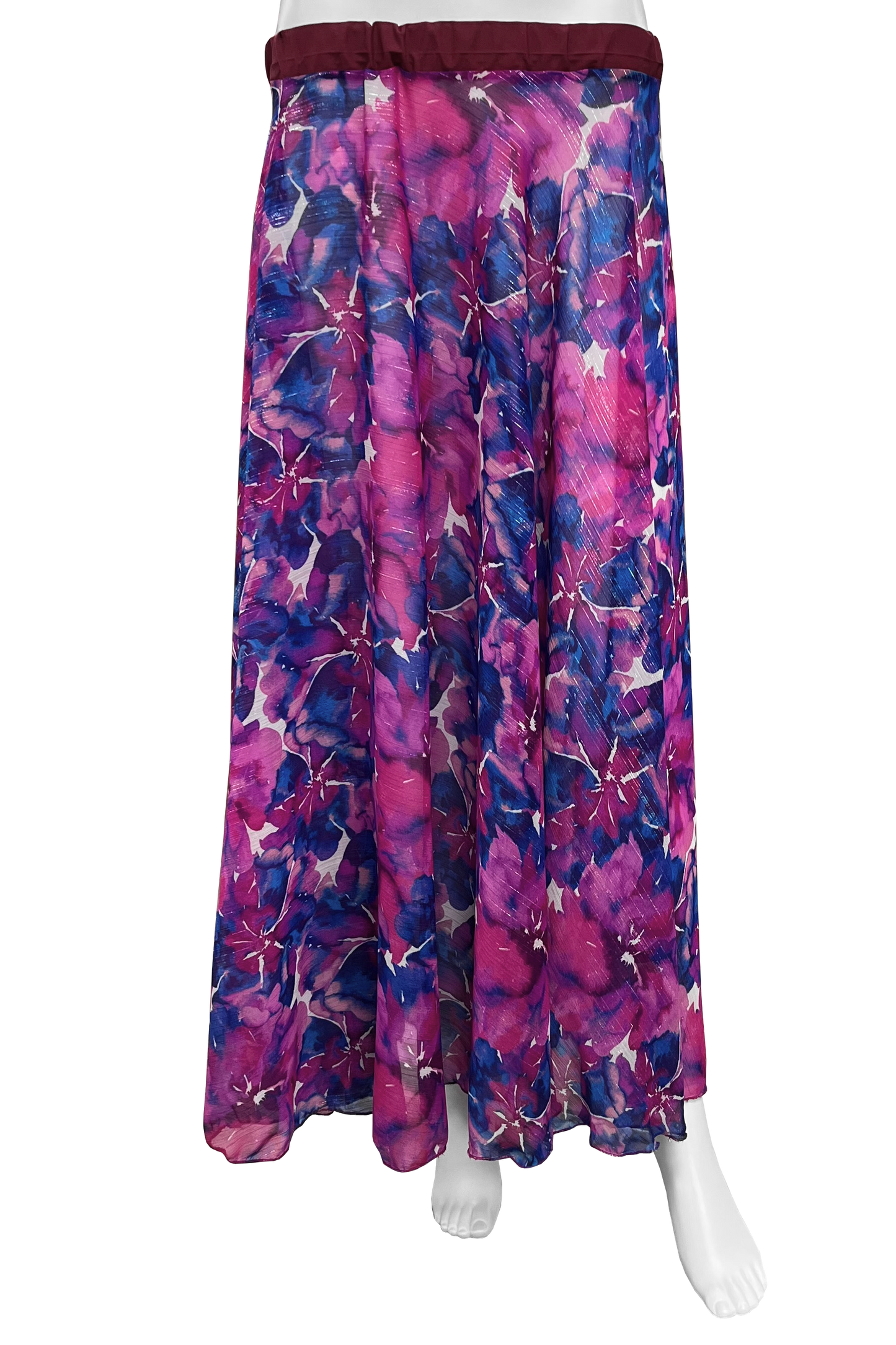A long skirt with a vibrant floral print in shades of magenta, purple, and blue, featuring a dark burgundy elastic waistband, displayed on a white mannequin against a white background.