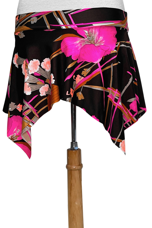 Floral-patterned mini skirt with pink flowers on a brown background