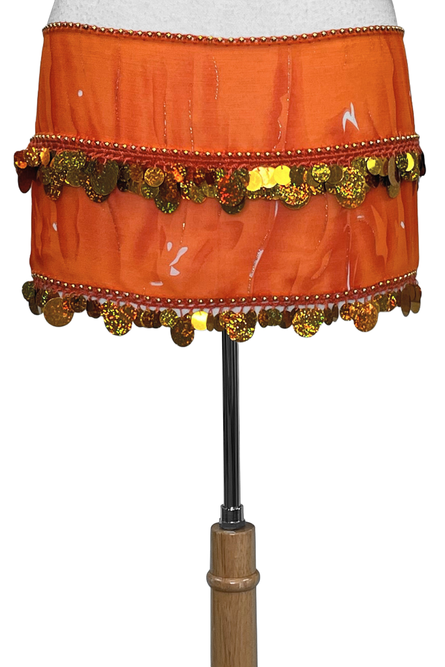 Orange hip scarf with metallic accents