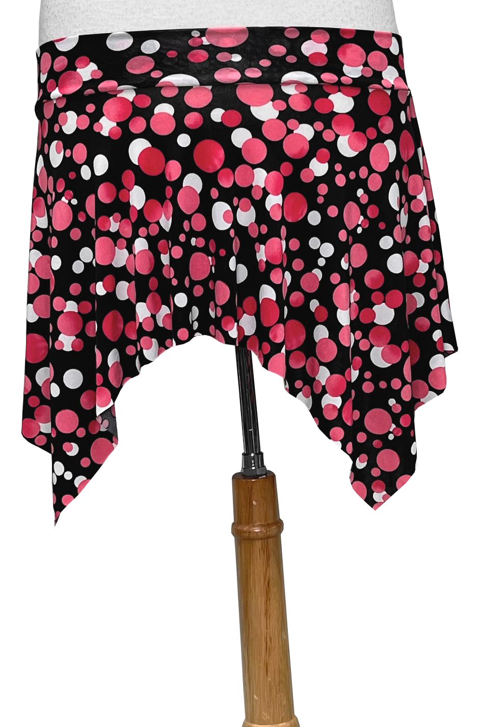 Black polka dot skirt with pink and white dots on a white background