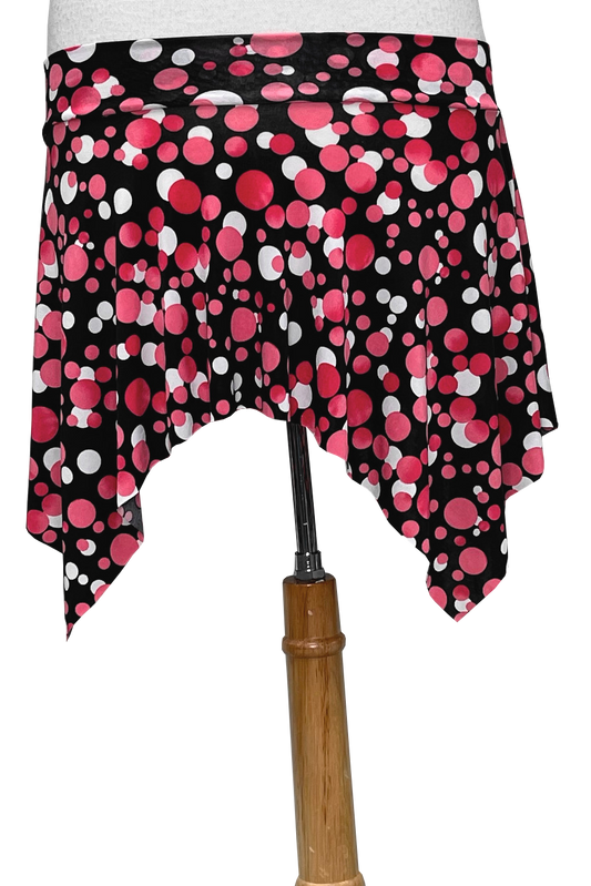 Black polka dot skirt with pink and white dots on a white background