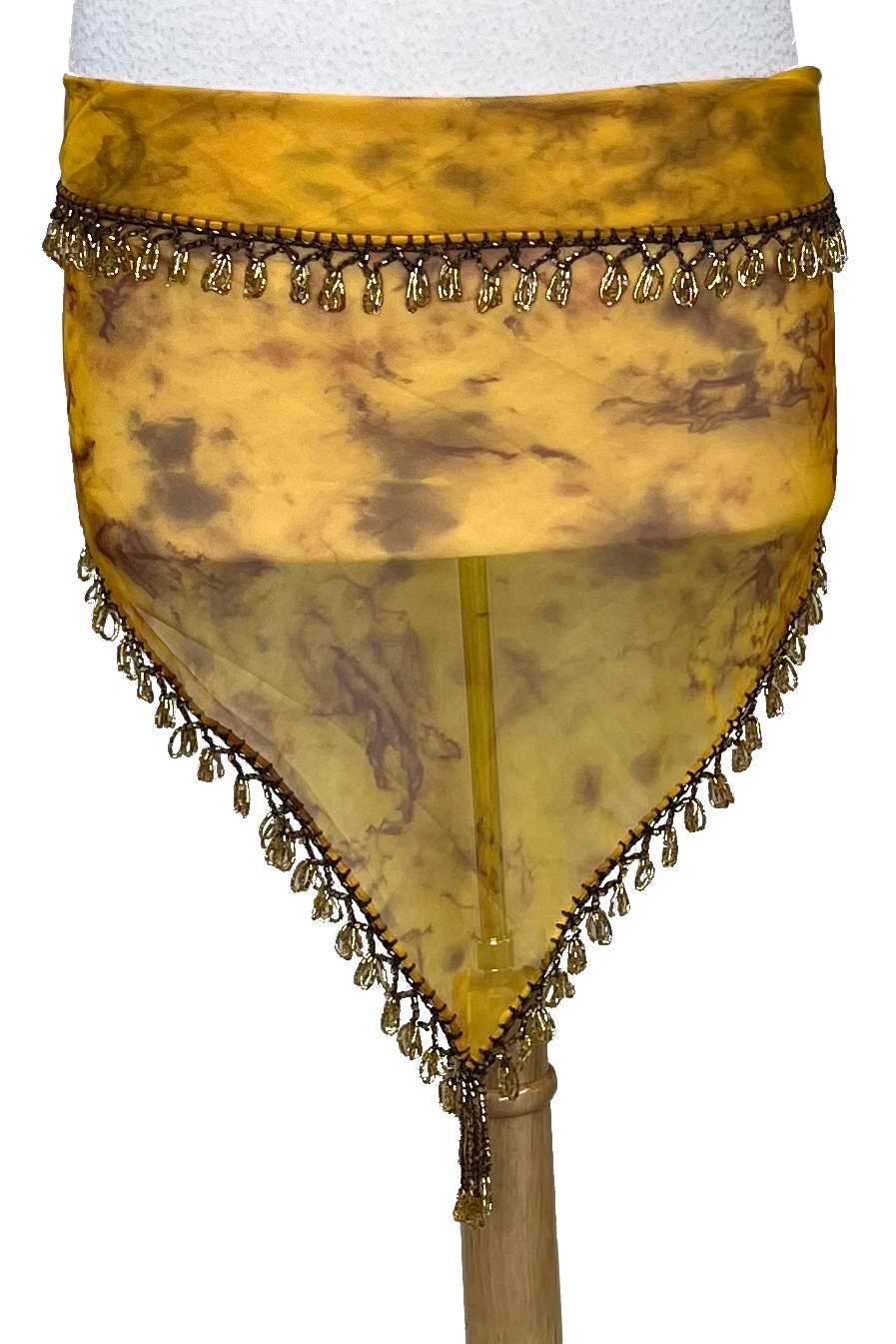 A yellow and brown marbled sheer mesh hip scarf with gold beaded fringe trim, displayed on a white mannequin torso.