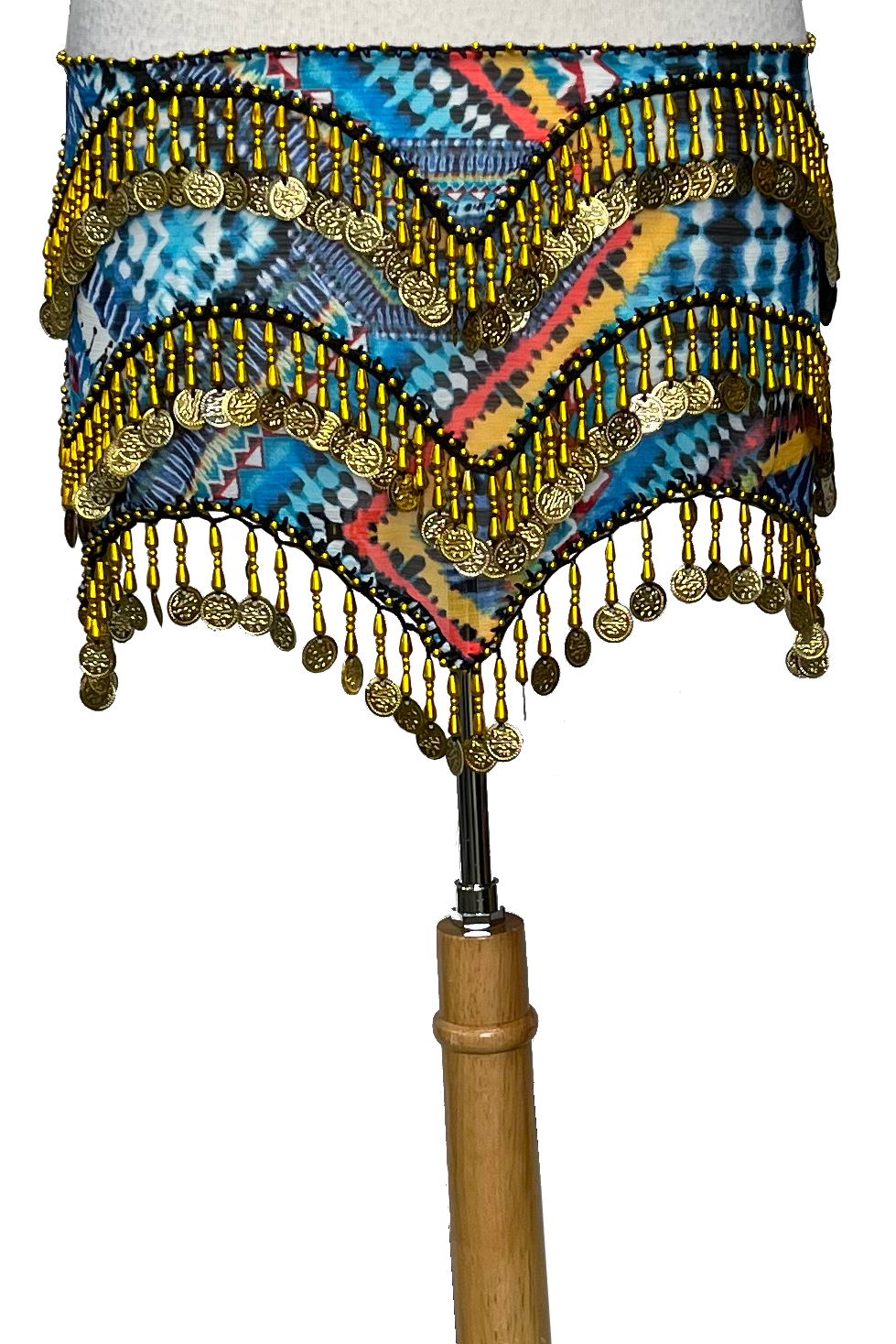 Colorful belly dance skirt with gold beads and a wooden stick on a white background