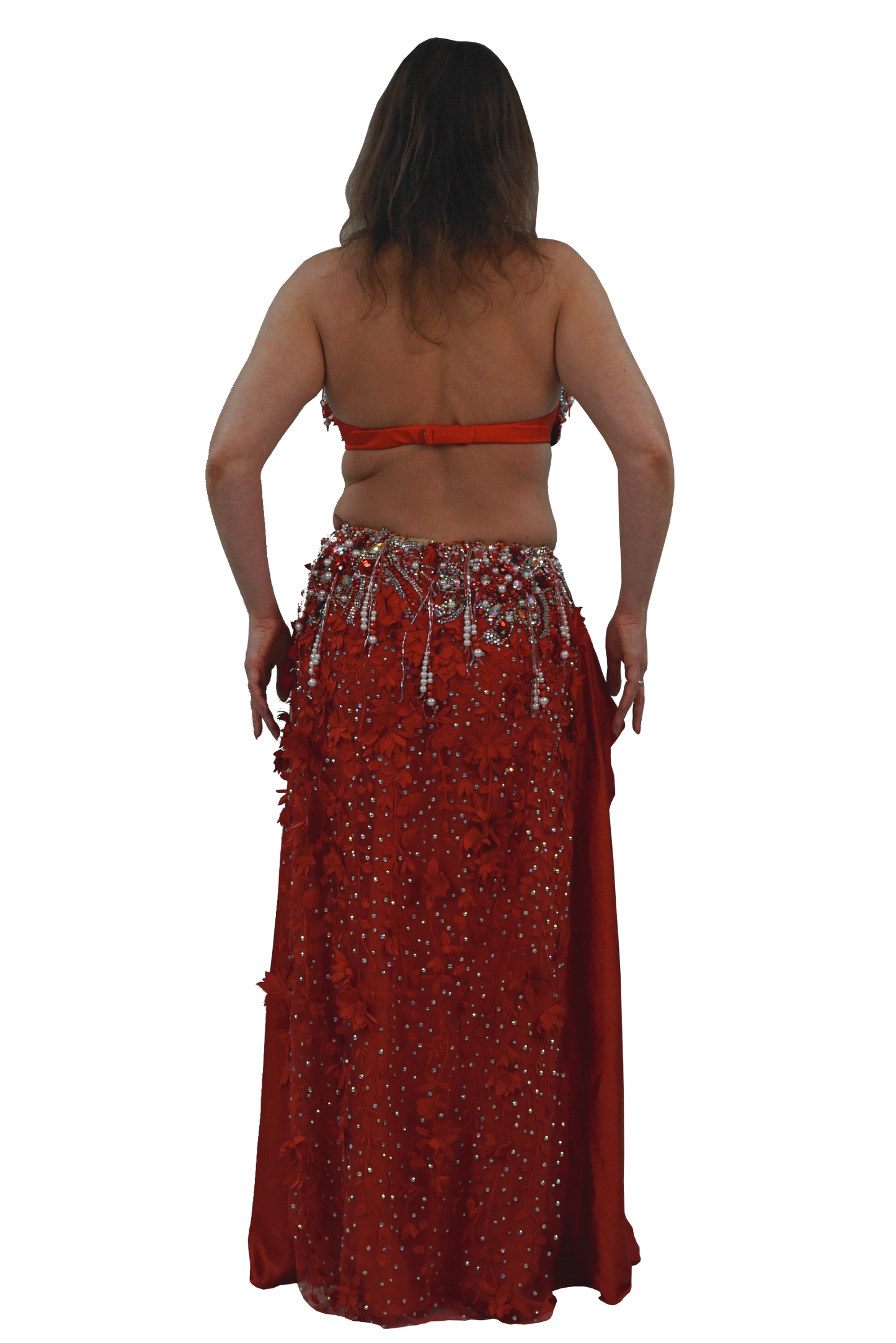 Woman wearing a red tow piece bellydance costume on a white background