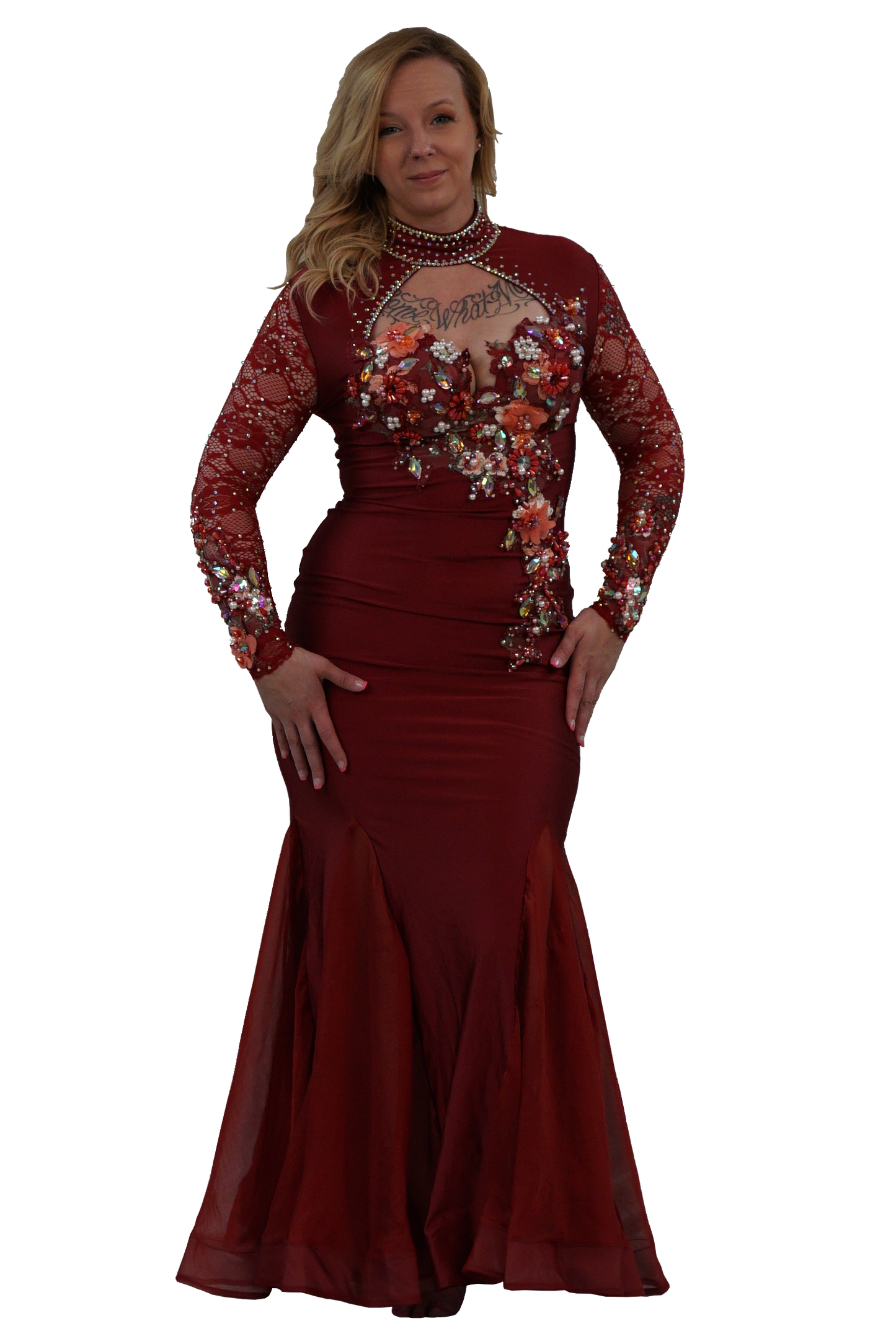A woman modeling a floor-length burgundy mermaid gown with long sheer lace sleeves, floral work on the bodice and sleeves, and a beaded choker, set against a plain white background.