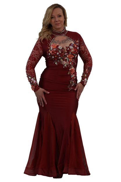 A woman modeling a floor-length burgundy mermaid gown with long sheer lace sleeves, floral work on the bodice and sleeves, and a beaded choker, set against a plain white background.