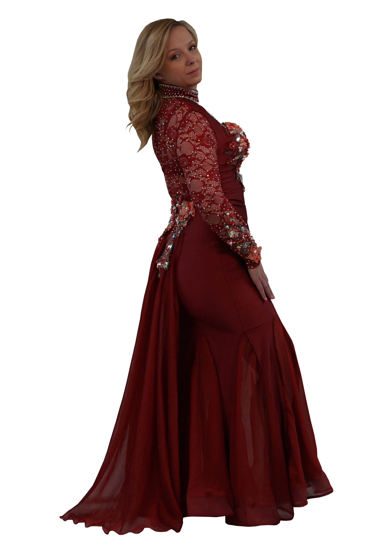 A woman modeling a floor-length burgundy mermaid gown with long sheer lace sleeves, floral work, and a high beaded neckline, shown against a plain white background.