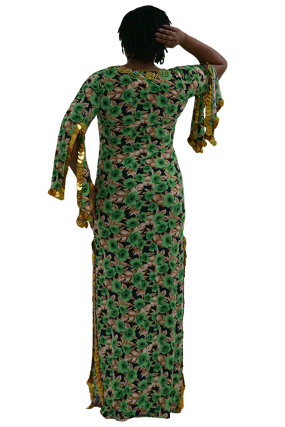 Woman wearing a green floral balady dress with gold accents on a white background