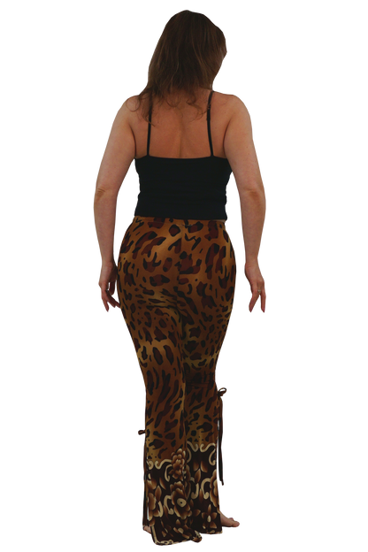 A woman shown from the back wearing leopard-print pants and a black spaghetti-strap top against a plain white background.