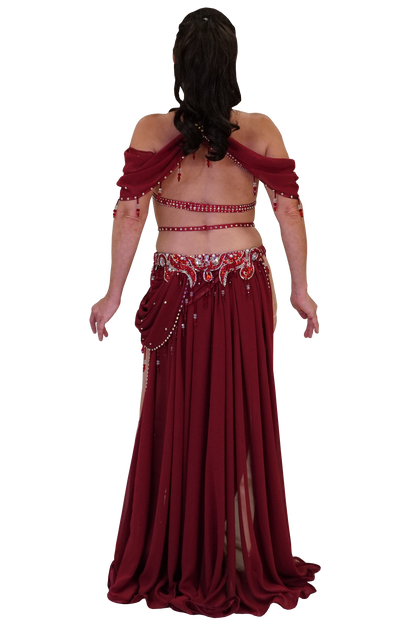 Red belly dance costume with intricate detailing on a white background