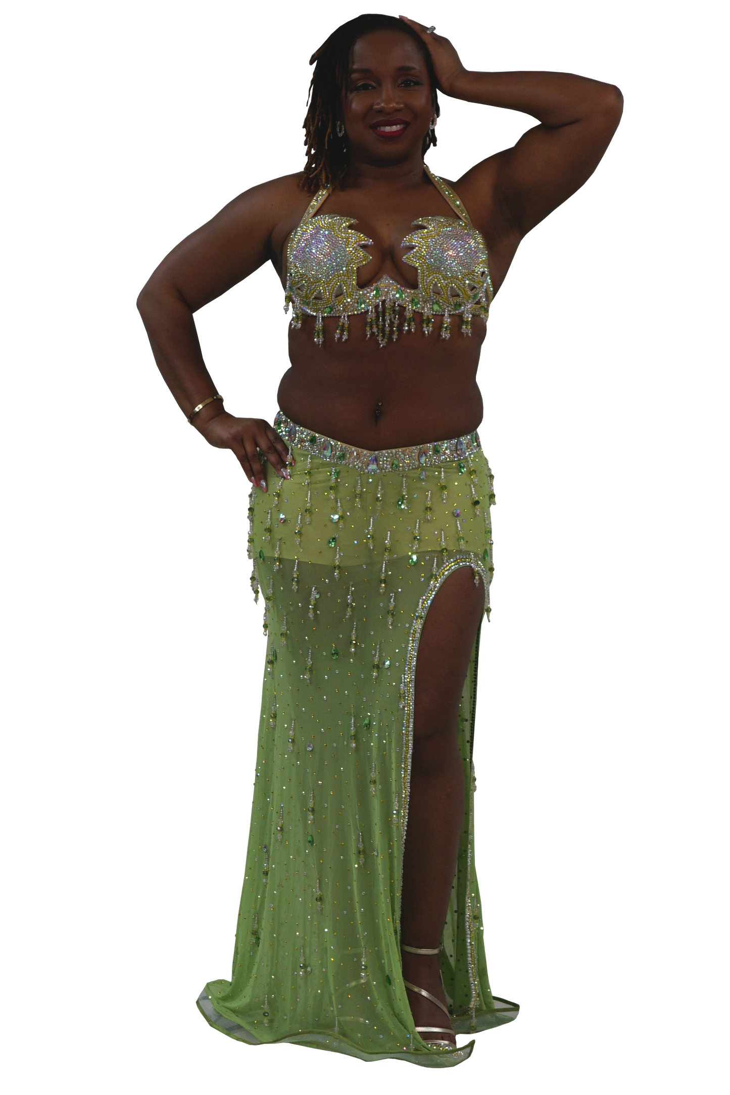 Woman wearing a green beaded bellydance costume on a white background