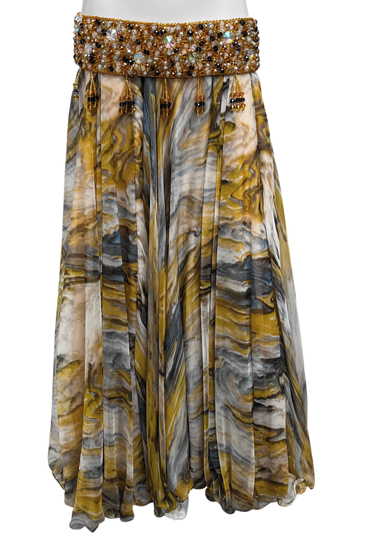 A maxi skirt with a marbled pattern in mustard yellow, gray, white, and brown.