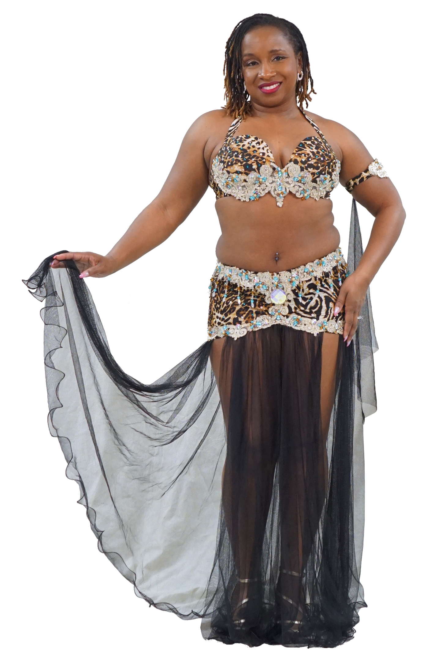 A woman modeling a belly dance costume with a leopard-print bra top, embellished hip scarf, matching hip scarf, sheer black tights, and a long flowing black sheer skirt, set against a plain white background.