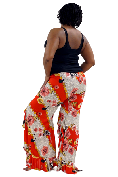 Woman wearing colorful floral pants with ruffles