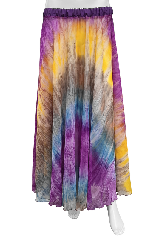 A maxi skirt with a vibrant tie-dye pattern in purple, yellow, blue, brown, and gray, displayed on a white mannequin against a solid white background.