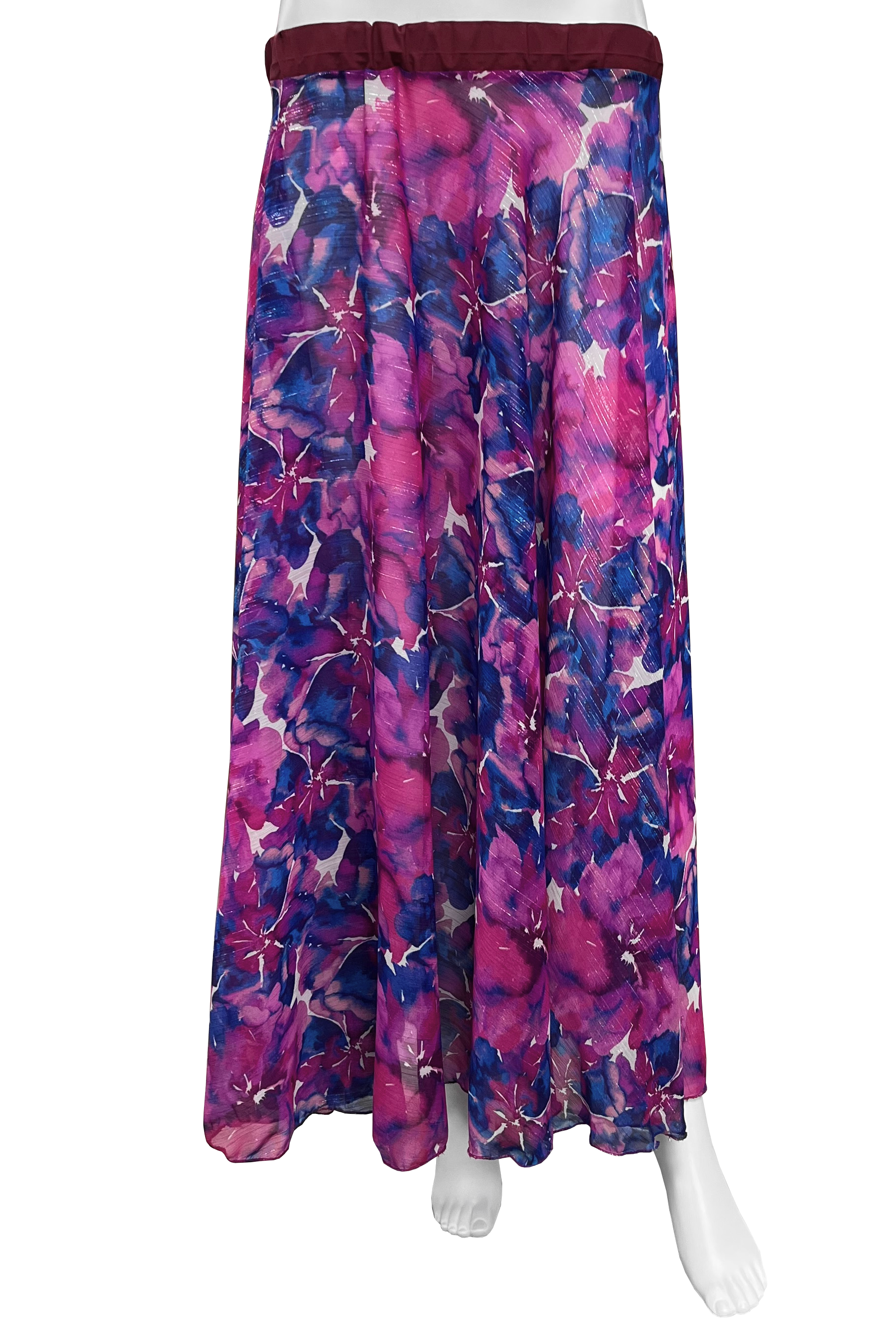 A long skirt with a vibrant floral print in shades of magenta, purple, and blue, featuring a dark burgundy elastic waistband, displayed on a white mannequin against a white background.
