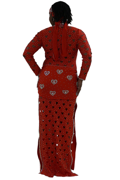 Red traditional outfit with intricate patterns on a white background